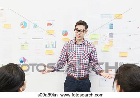 Man in front of adhesive notes on wall View Large Photo Image Picture - Man in front of adhesive notes on wall. Fotosearch