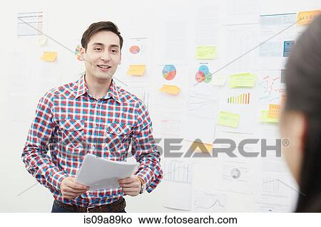 Man in front of adhesive notes on wall View Large Photo Image Picture - Man in front of adhesive notes on wall. Fotosearch