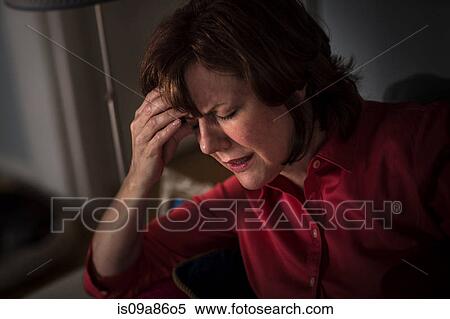 Mature woman with hand on head and eyes closed View Large Photo Image Stock Photography - Mature woman with hand on head and eyes closed. Fotosearch