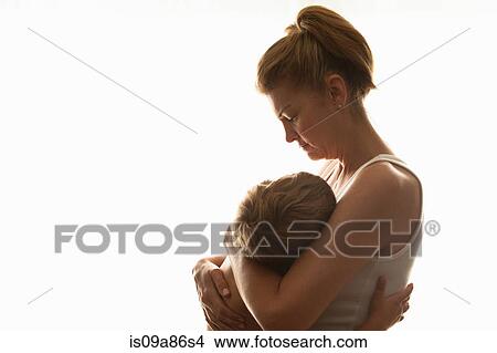 Picture - Mother hugging son. Fotosearch