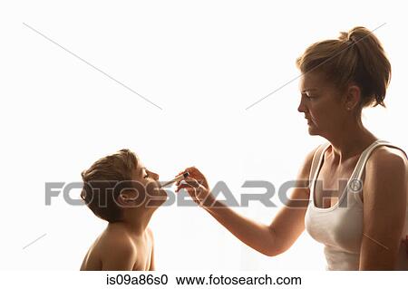Mother taking son's temperature View Large Photo Image Stock Image - Mother taking son's temperature. Fotosearch