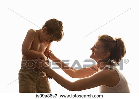 Stock Photo - Mother tickling son. Fotosearch