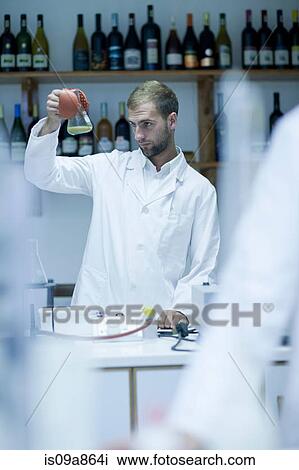 Oenologist checking laboratory tests View Large Photo Image Stock Image - Oenologist checking laboratory tests. Fotosearch