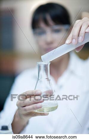 Oenologist mixing during sample testing in laboratory View Large Photo Image Picture - Oenologist mixing during sample testing in laboratory. Fotosearch