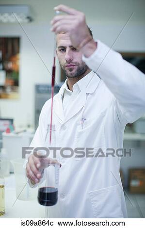 Oenologist mixing during sample testing in laboratory View Large Photo Image Stock Image - Oenologist mixing during sample testing in laboratory. Fotosearch