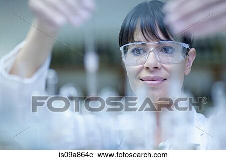 Oenologist mixing during sample testing in laboratory View Large Photo Image Stock Image - Oenologist mixing during sample testing in laboratory. Fotosearch