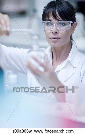 Oenologist mixing during sample testing in laboratory View Large Photo Image Stock Photo - Oenologist mixing during sample testing in laboratory. Fotosearch