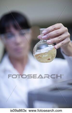 Oenologist mixing during sample testing in laboratory View Large Photo Image Stock Photo - Oenologist mixing during sample testing in laboratory. Fotosearch