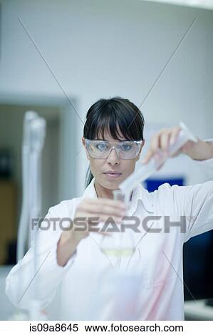 Oenologist mixing during sample testing in laboratory View Large Photo Image Stock Photography - Oenologist mixing during sample testing in laboratory. Fotosearch