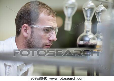 Oenologist monitoring sample testing in laboratory View Large Photo Image Stock Image - Oenologist monitoring sample testing in laboratory. Fotosearch