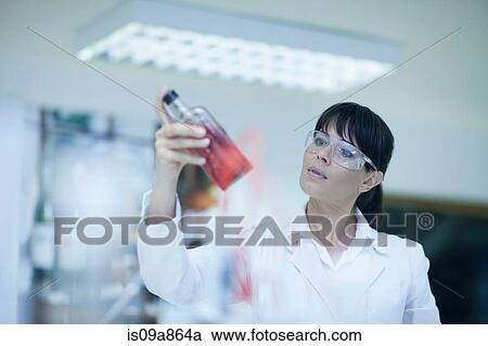 Oenologist monitoring sample testing in laboratory View Large Photo Image Stock Image - Oenologist monitoring sample testing in laboratory. Fotosearch