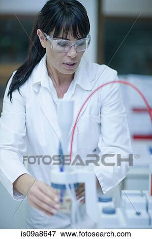 Oenologist monitoring sample testing in laboratory View Large Photo Image Stock Photo - Oenologist monitoring sample testing in laboratory. Fotosearch