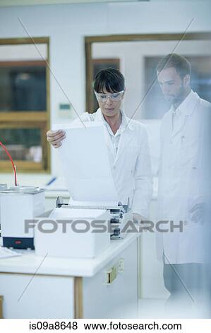 Oenologist monitoring sample testing in laboratory View Large Photo Image Stock Photo - Oenologist monitoring sample testing in laboratory. Fotosearch