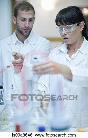 Oenologist monitoring sample testing in laboratory View Large Photo Image Stock Photograph - Oenologist monitoring sample testing in laboratory. Fotosearch