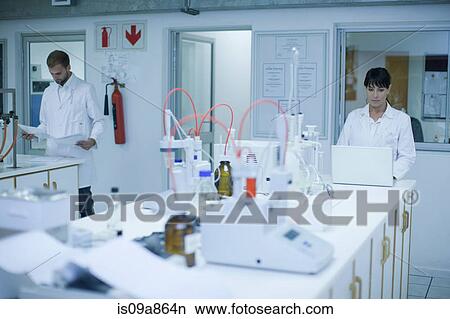 Oenologists at work View Large Photo Image Picture - Oenologists at work. Fotosearch