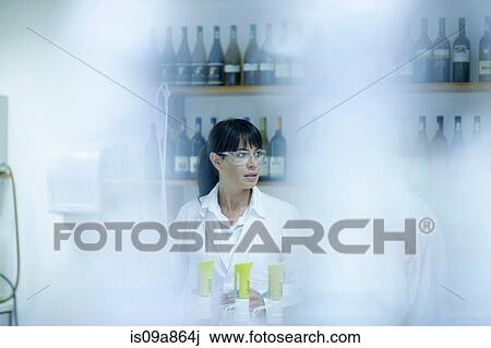 Oenologists at work View Large Photo Image Stock Image - Oenologists at work. Fotosearch