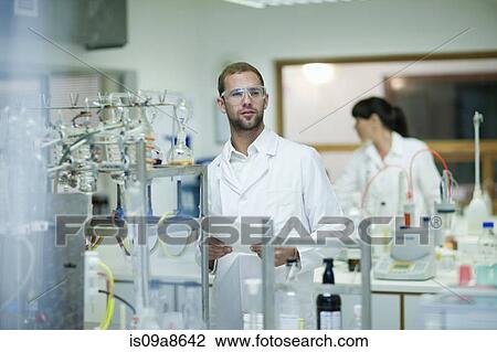 Oenologists monitoring sample testing in laboratory View Large Photo Image Stock Image - Oenologists monitoring sample testing in laboratory. Fotosearch