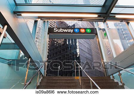 Stock Photograph - Office buildings and subway entrance, New York City, USA. Fotosearch