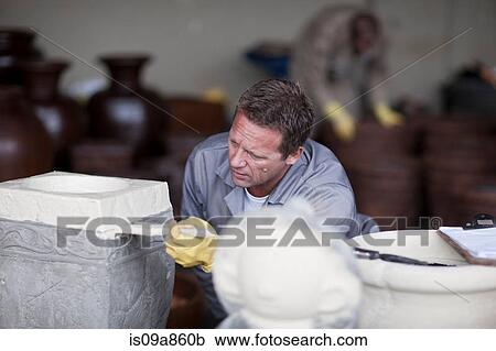 Painting and staining process in pottery factory View Large Photo Image Stock Image - Painting and staining process in pottery factory. Fotosearch