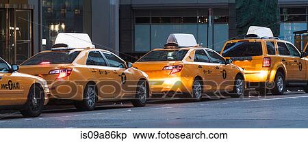 Stock Photography - Panoramic of yellow taxis in a row, New York City, USA. Fotosearch