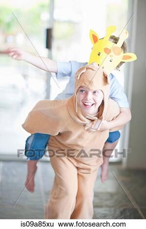 Stock Photograph - Piggy back fun. Fotosearch