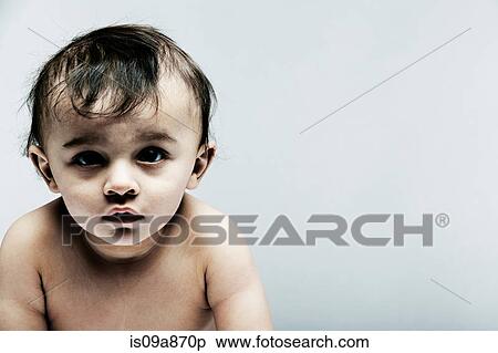 Portrait of baby boy looking at camera View Large Photo Image Stock Photography - Portrait of baby boy looking at camera. Fotosearch