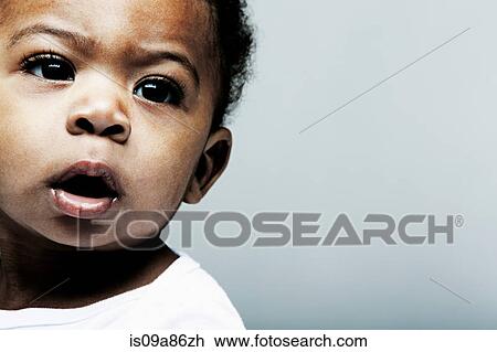 Portrait of baby boy looking away View Large Photo Image Stock Image - Portrait of baby boy looking away. Fotosearch