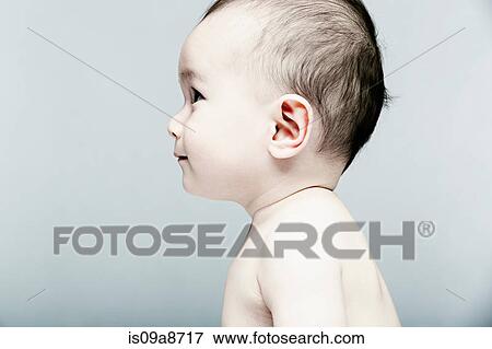 Stock Photo - Portrait of baby boy looking away. Fotosearch