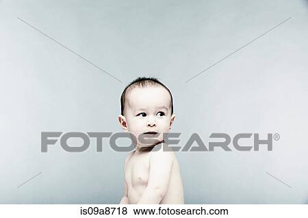 Portrait of baby boy looking away View Large Photo Image Stock Photo - Portrait of baby boy looking away. Fotosearch