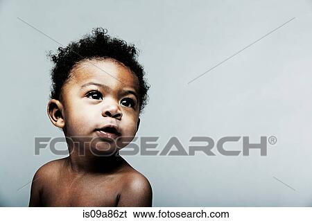 Portrait of baby boy looking away View Large Photo Image Stock Photograph - Portrait of baby boy looking away. Fotosearch