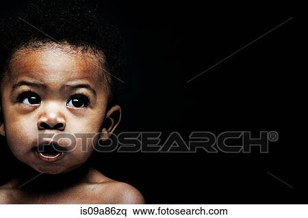 Portrait of baby boy looking away View Large Photo Image Stock Photography - Portrait of baby boy looking away. Fotosearch
