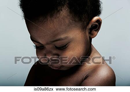 Portrait of baby boy looking down View Large Photo Image Stock Photo - Portrait of baby boy looking down. Fotosearch