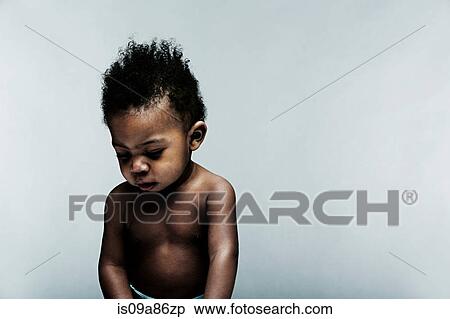 Portrait of baby boy looking down View Large Photo Image Stock Photography - Portrait of baby boy looking down. Fotosearch