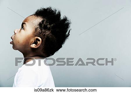 Stock Image - Portrait of baby boy looking up. Fotosearch
