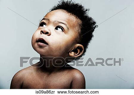 Portrait of baby boy looking up View Large Photo Image Stock Photography - Portrait of baby boy looking up. Fotosearch