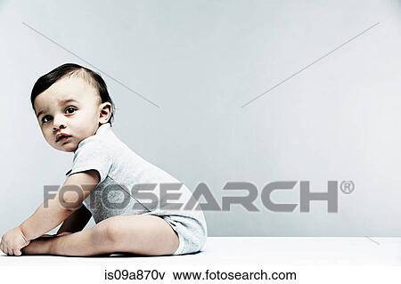 Portrait of baby boy wearing grey baby vest View Large Photo Image Stock Photo - Portrait of baby boy wearing grey baby vest. Fotosearch