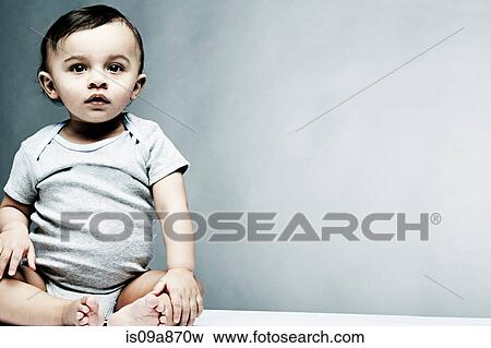 Portrait of baby boy wearing grey baby vest View Large Photo Image Stock Photo - Portrait of baby boy wearing grey baby vest. Fotosearch