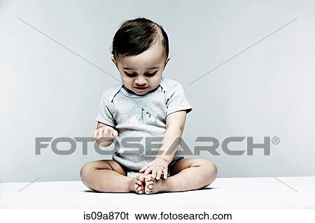 Portrait of baby boy wearing grey baby vest View Large Photo Image Stock Photograph - Portrait of baby boy wearing grey baby vest. Fotosearch