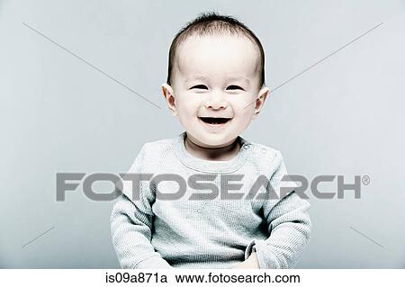 Portrait of baby boy wearing grey top View Large Photo Image Stock Image - Portrait of baby boy wearing grey top. Fotosearch