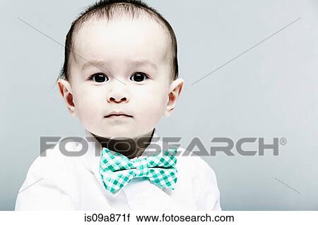 Portrait of baby boy wearing shirt and bow tie View Large Photo Image Stock Image - Portrait of baby boy wearing shirt and bow tie. Fotosearch