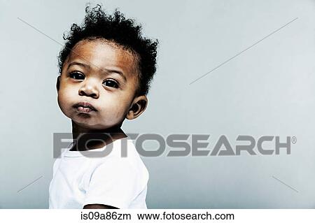Portrait of baby boy wearing white looking at camera View Large Photo Image Picture - Portrait of baby boy wearing white looking at camera. Fotosearch