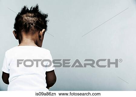 Portrait of baby boy wearing white vest, rear view View Large Photo Image Picture - Portrait of baby boy wearing white vest, rear view. Fotosearch