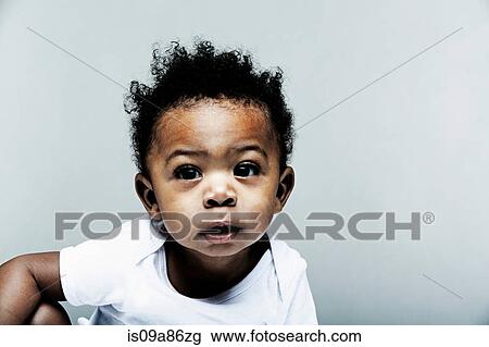 Portrait of baby boy wearing white vest View Large Photo Image Stock Image - Portrait of baby boy wearing white vest. Fotosearch