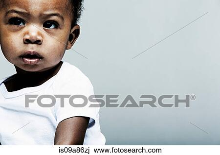 Portrait of baby boy wearing white vest View Large Photo Image Stock Image - Portrait of baby boy wearing white vest. Fotosearch