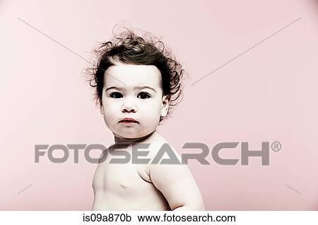 Portrait of baby girl against pink background View Large Photo Image Stock Image - Portrait of baby girl against pink background. Fotosearch