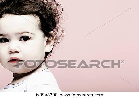 Portrait of baby girl against pink background View Large Photo Image Stock Photo - Portrait of baby girl against pink background. Fotosearch