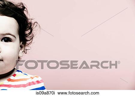Portrait of baby girl wearing striped top View Large Photo Image Stock Image - Portrait of baby girl wearing striped top. Fotosearch