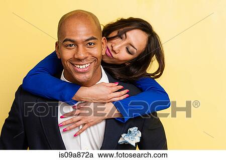 Stock Image - Portrait of mid adult couple smiling. Fotosearch