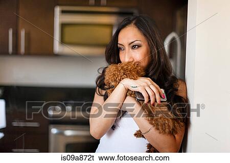 Portrait of mid adult female with dog and smartphone View Large Photo Image Stock Photograph - Portrait of mid adult female with dog and smartphone. Fotosearch
