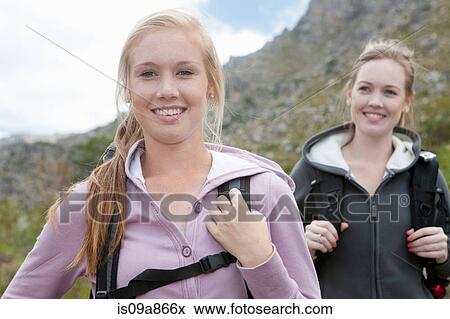 Stock Photo - Portrait of two girls hiking. Fotosearch